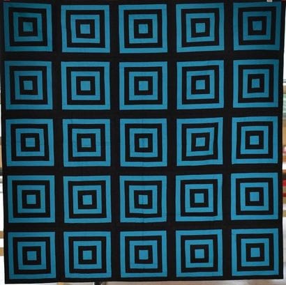 Quilt formé de baguettes noires et bleues...