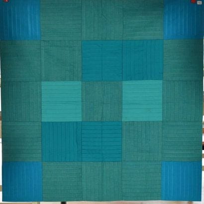 Petit quilt carré formé de baguettes vertes...