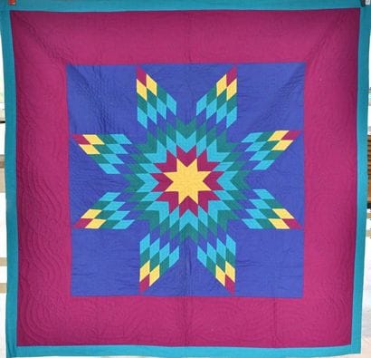 Quilt étoile au centre d'un carré bleu, une...