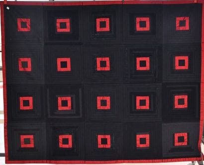 Quilt à fond noir formé de baguettes de coton...