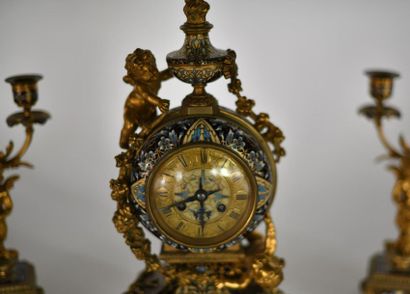 Gilded bronze mantel set enamelled with floral...