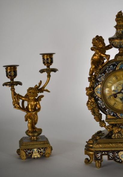 Gilded bronze mantel set enamelled with floral...