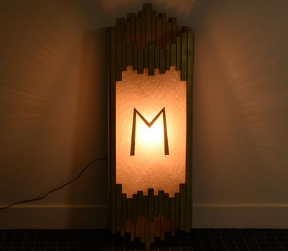A free-form wall light, made of gilded steel...