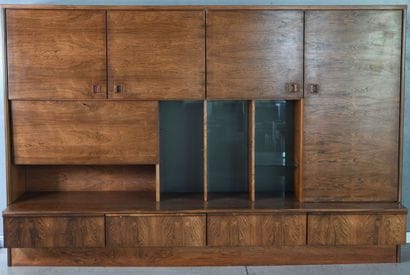 
Living room in rosewood veneer and glass...