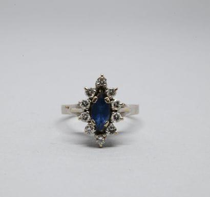 A 750‰ white gold marquise ring, centered...
