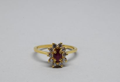 Yellow gold 750‰ daisy ring, centered with...
