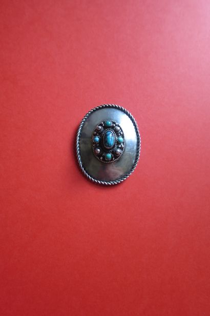 Oval silver or silver plated metal brooch-pendant...