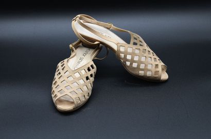 Charles JOURDAN. Pair of beige openwork leather...