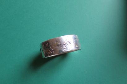 Hollow silver band bracelet engraved with...
