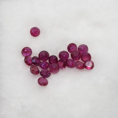 Lot of small raspberry rubies on paper, round...