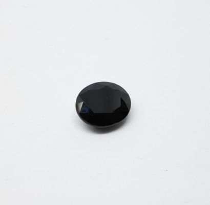 Black sapphire on paper, oval-cut, faceted,...