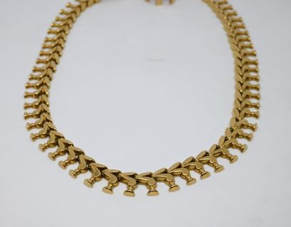 Collier draperie en or jaune 750‰

Poinçon...
