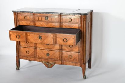 Chest of drawers with a slight central projection...