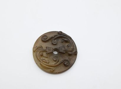 Jade Bi disc with chilong decoration. 

China,...