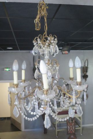 A gilt bronze scrolled chandelier with a...