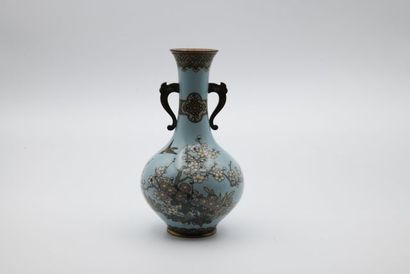 A bronze and cloisonné enamel vase decorated...