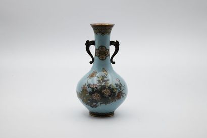 A bronze and cloisonné enamel vase decorated...