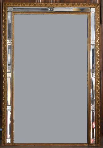 A stuccoed and gilded wood mirror with pearls...