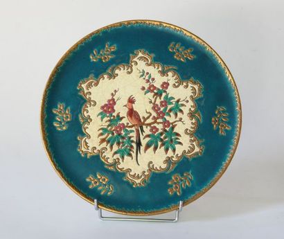 LONGWY. Plat à gâteau en faïence émaillée...
