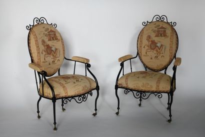 Pair of wrought iron armchairs painted black,...