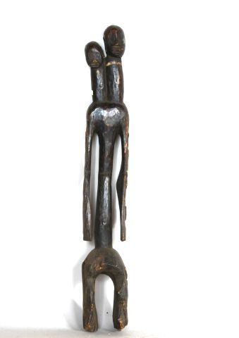 NIGERIA 

Statue à tête janus en bois à patine...