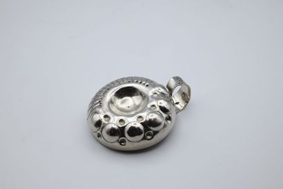 Small silver wine taster with embossed decoration...