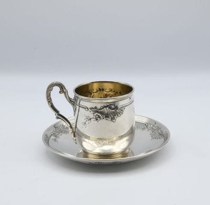Cup and saucer with rocaille style design...