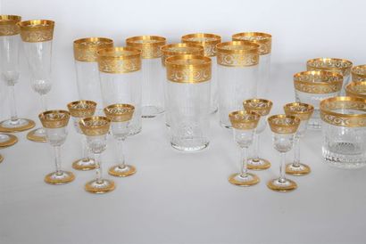 SAINT-LOUIS. Set of crystal glasses and gold...