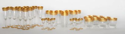 SAINT-LOUIS. Set of crystal glasses and gold...
