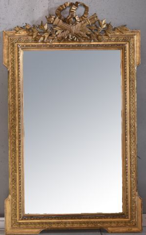 Grand miroir à écoinçons en bois sculpté...