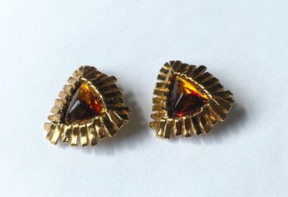 YVES SAINT LAURENT. Ear clips in gilded metal...