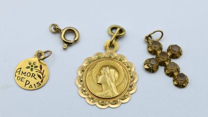 Lot of three pendants including:

- a yellow...