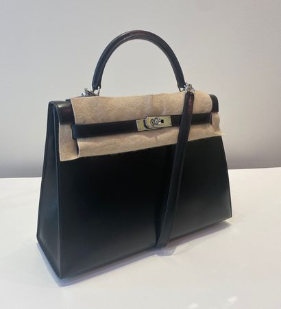 
HERMES. A black calf box leather sellier...
