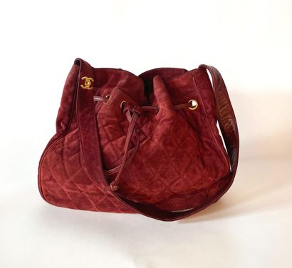 CHANEL. Circa 1994. Bag in burgundy suede...