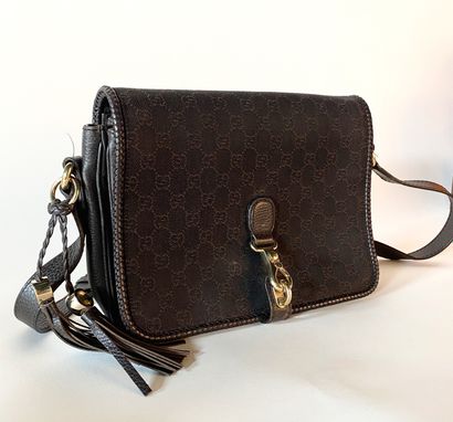 GUCCI. Shoulder bag in GG canvas and brown...