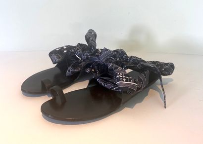 HERMES. Flat sandals in black leather, ankle...