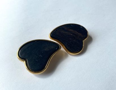 YVES SAINT LAURENT. Ear clips in gilded metal...
