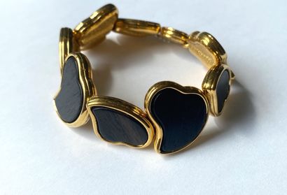 YVES SAINT LAURENT. Bracelet in gilded metal...