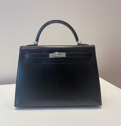 
HERMES. A black calf box leather sellier...