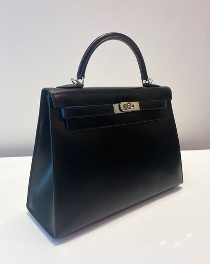 
HERMES. A black calf box leather sellier...