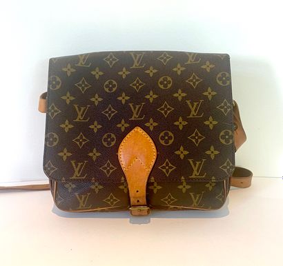 LOUIS VUITTON. Cartouchière bag in Monogram...