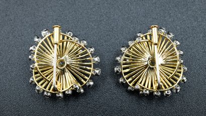 Pair of spiral brooches with modern cut diamonds.

The...