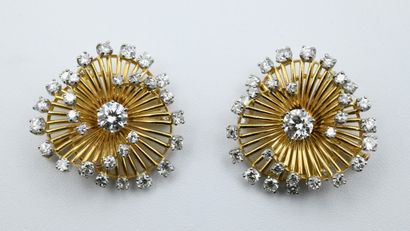 Pair of spiral brooches with modern cut diamonds.

The...