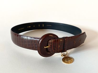 YVES SAINT LAURENT. Brown leather belt embossed...