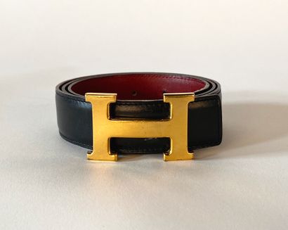 HERMES. Black leather H belt, gold metal...