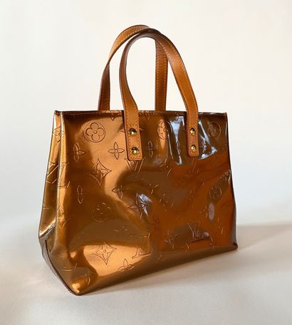 LOUIS VUITTON. Reade PM bag in Monogram patent...