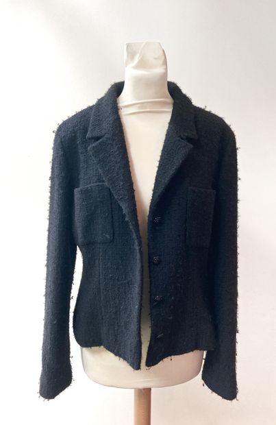 CHANEL. Black suit jacket in wool (85%) and...