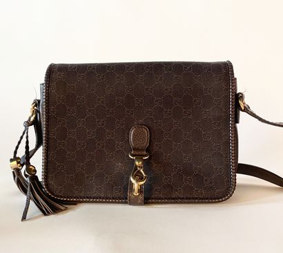 GUCCI. Shoulder bag in GG canvas and brown...