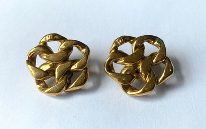 CHANEL. Ear clips in gilded metal, featuring...