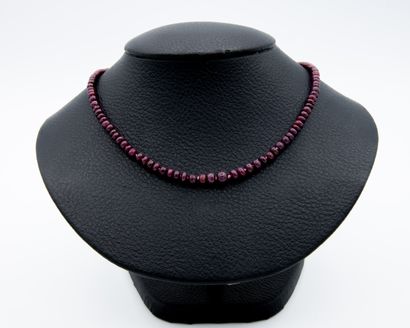 *Necklace of rolled ruby pearls in fall,...